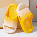 Gradient coloured PVC summer slippers for children on a plain background, showing the non-slip sole.