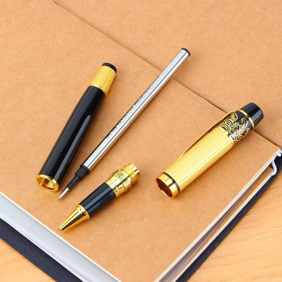 Black metal fountain pen with iridium nib and patterned orb design, shown on a desk