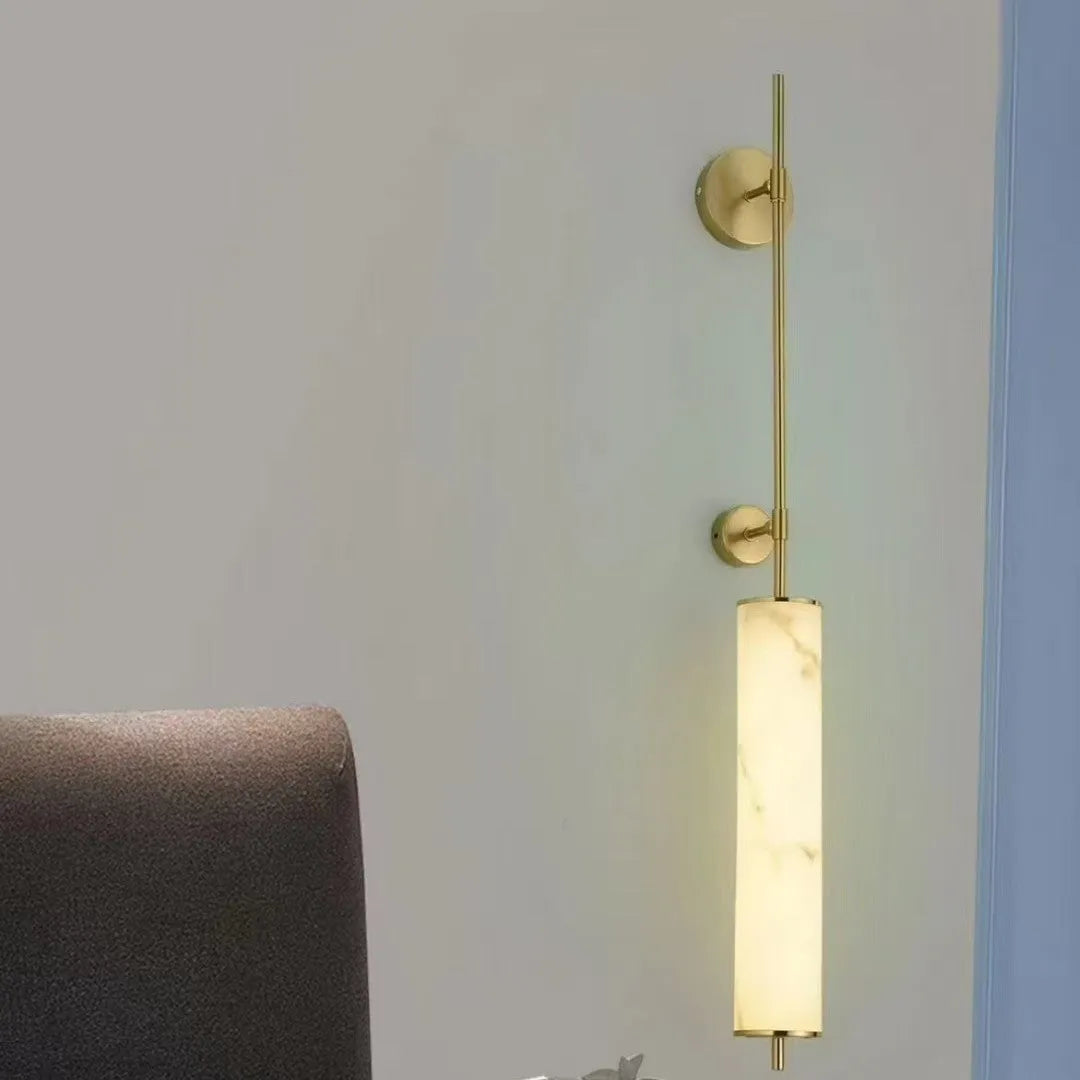 Marble wall lamp with warm light, black finish, 50cm long, mounted on a living room wall