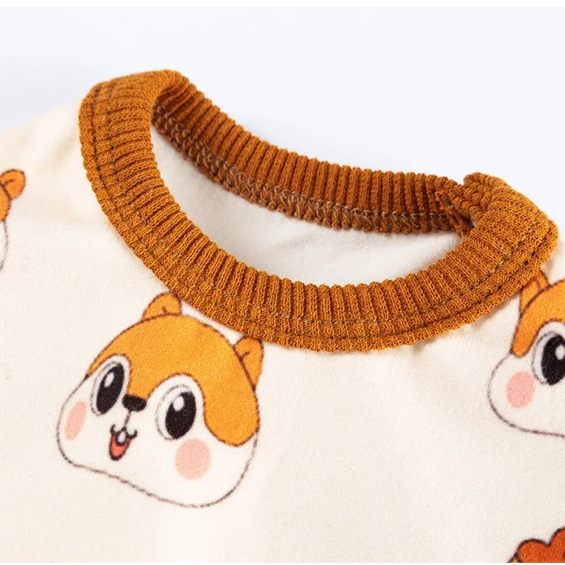 Chip 'n' Dale sleeveless dog jumpsuit with squirrel and acorn print, fuzzy embroidered acorn pocket, ribbed cuffs and snap closure, cream or white.