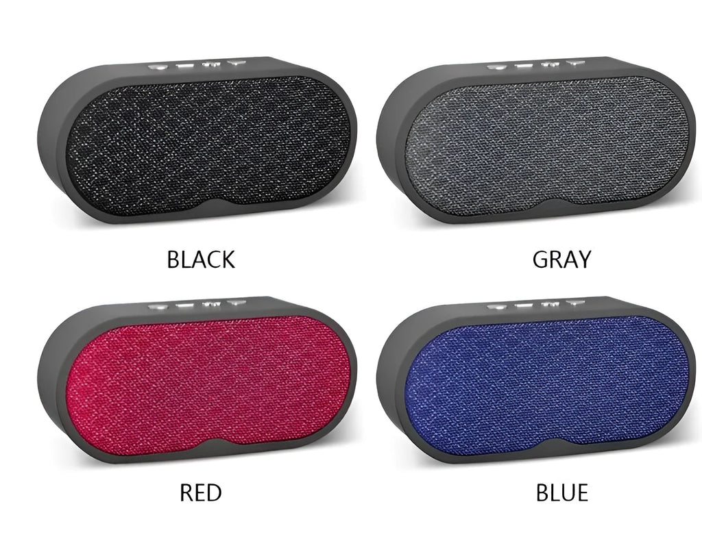 Portable grey Bluetooth speaker with HD microphone on a table