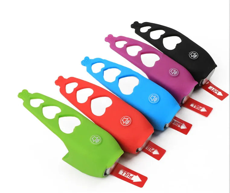 Plastic electronic bicycle horn in six colour options shown with two 2032 batteries.