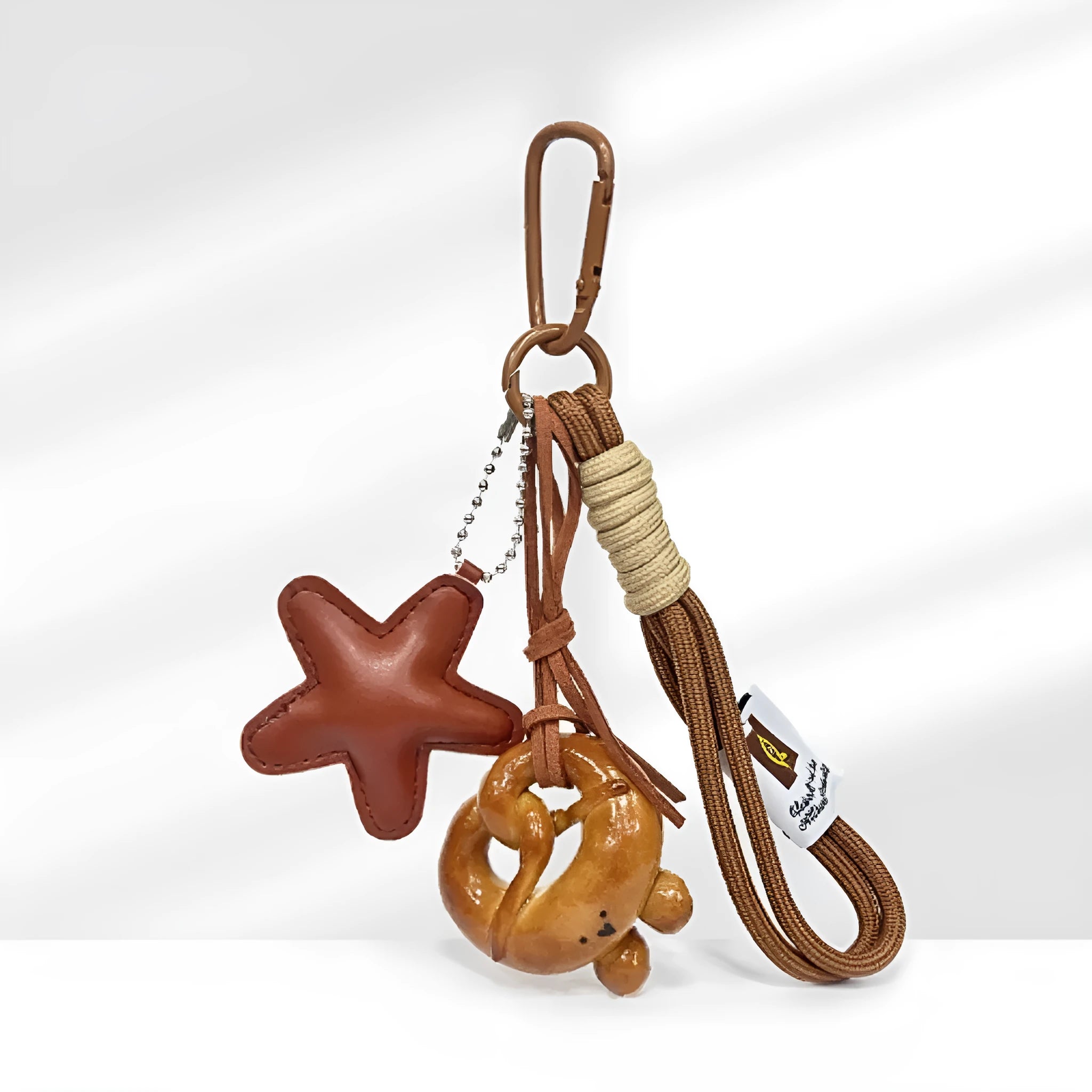 Handmade soda bread style handbag pendant charm with cartoon bread design and brown star accents