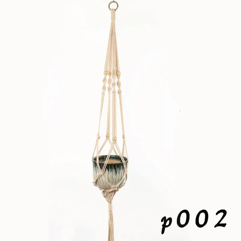 A rustic woven wire plant basket made from cotton rope, holding a green potted plant.
