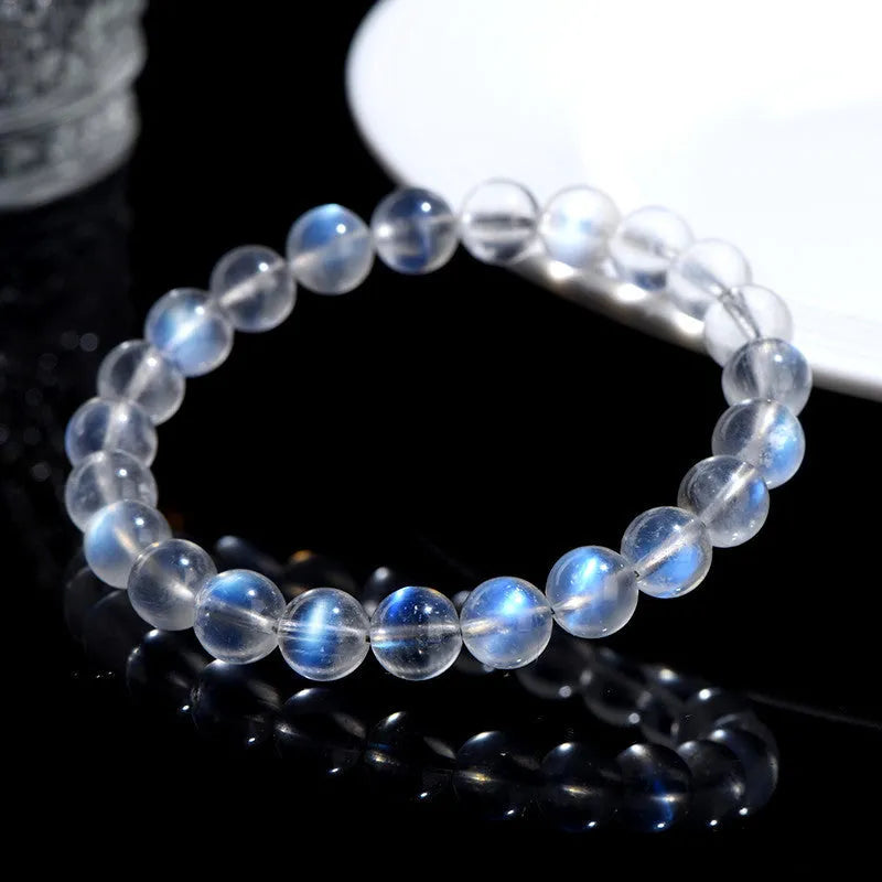 Natural cream body blue moonlight crystal bracelet showing various bead size options on a white background.