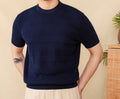 Men's off-white pure cotton short sleeve T-shirt with a round neck on a hanger.