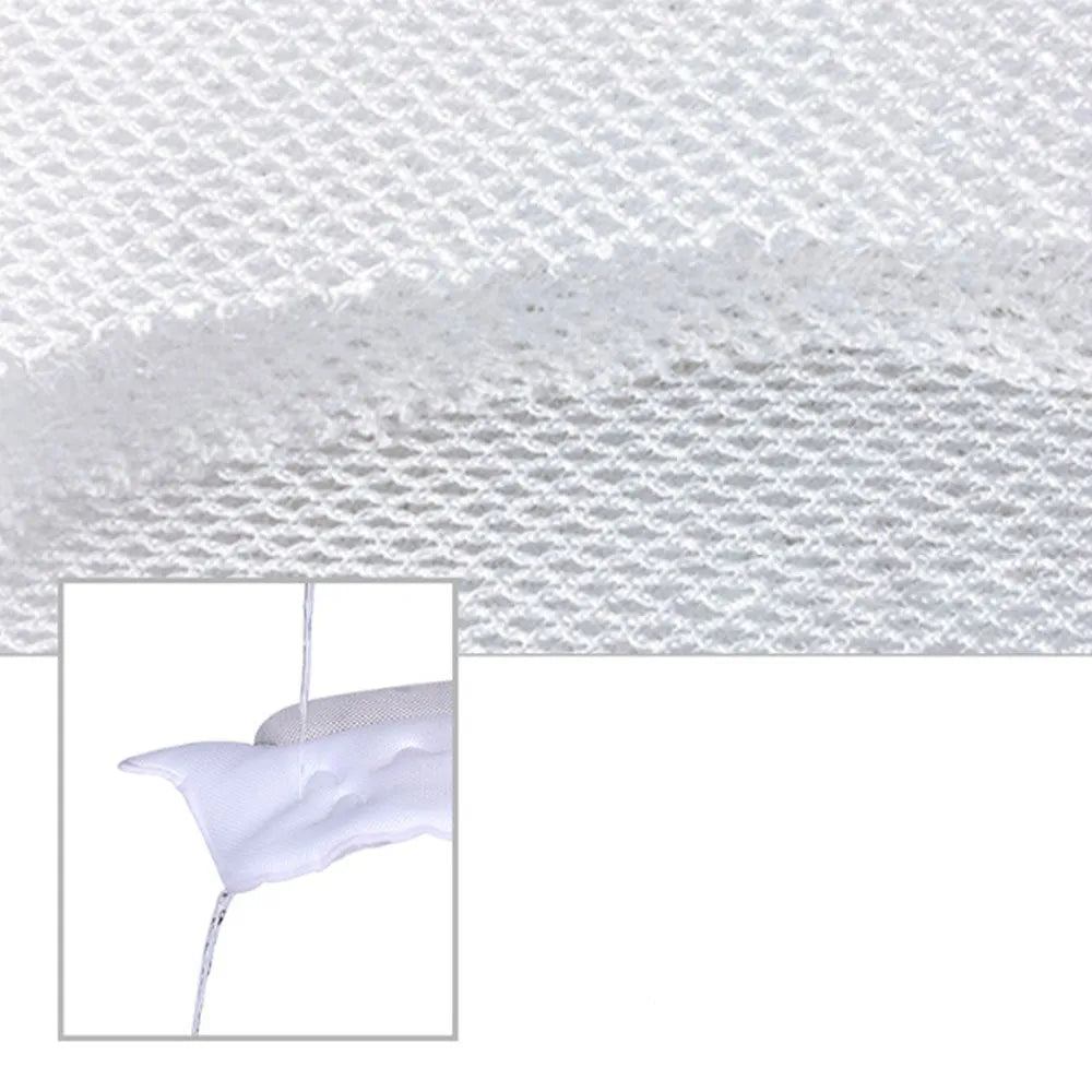 White ergonomic bathtub pillow with owl shape, 5D mesh fabric, and strong suction cups on a smooth bath surface