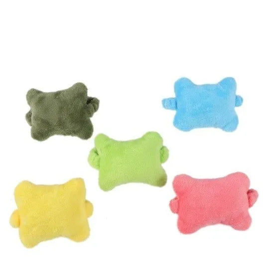 Plush wrist protector mouse pad in blue, green, and pink colours on a desk.