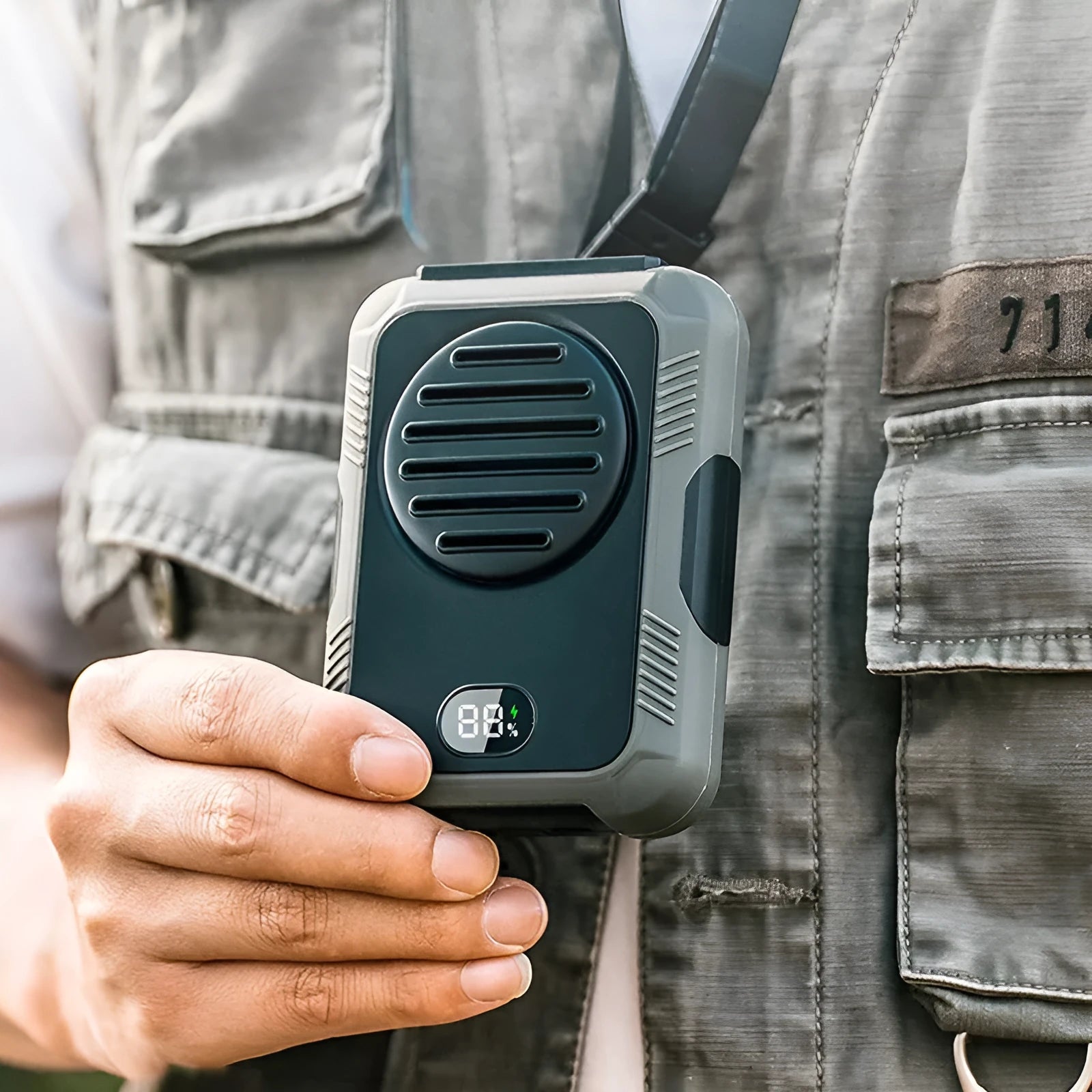 Green portable hanging neck fan for outdoor sports with USB charging cable.