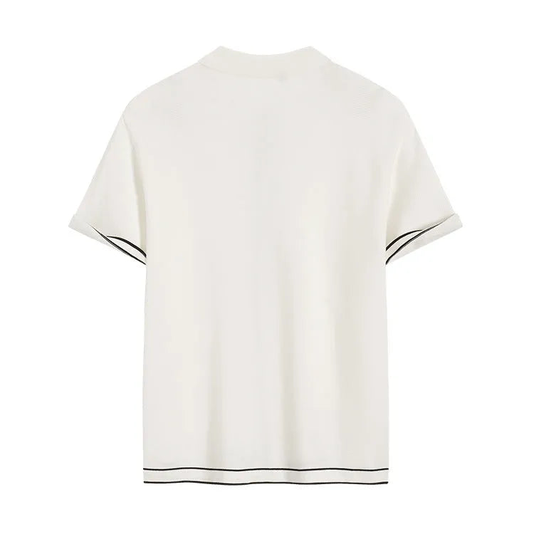 White short sleeve cardigan with dark contrast lapels laid flat.