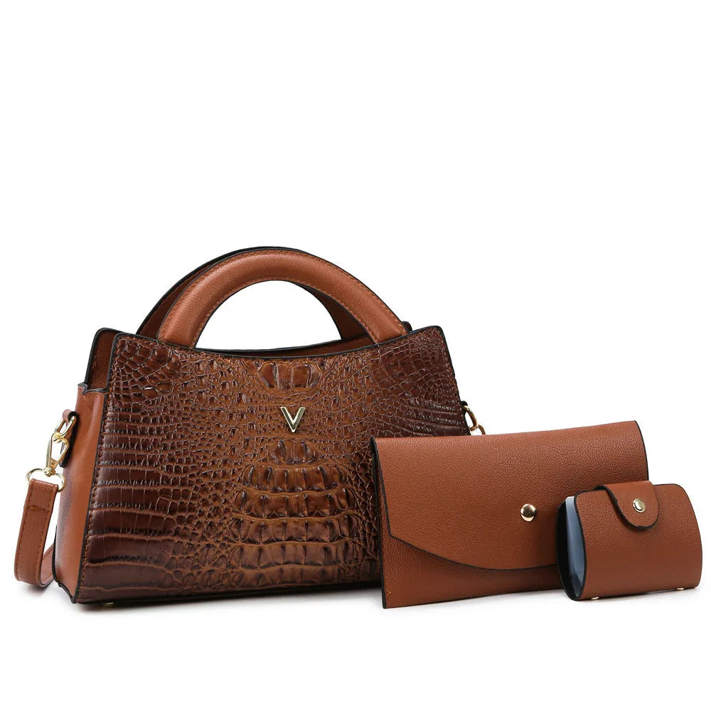 Women's black crocodile pattern PU leather crossbody handbag with square vertical shape and single strap.