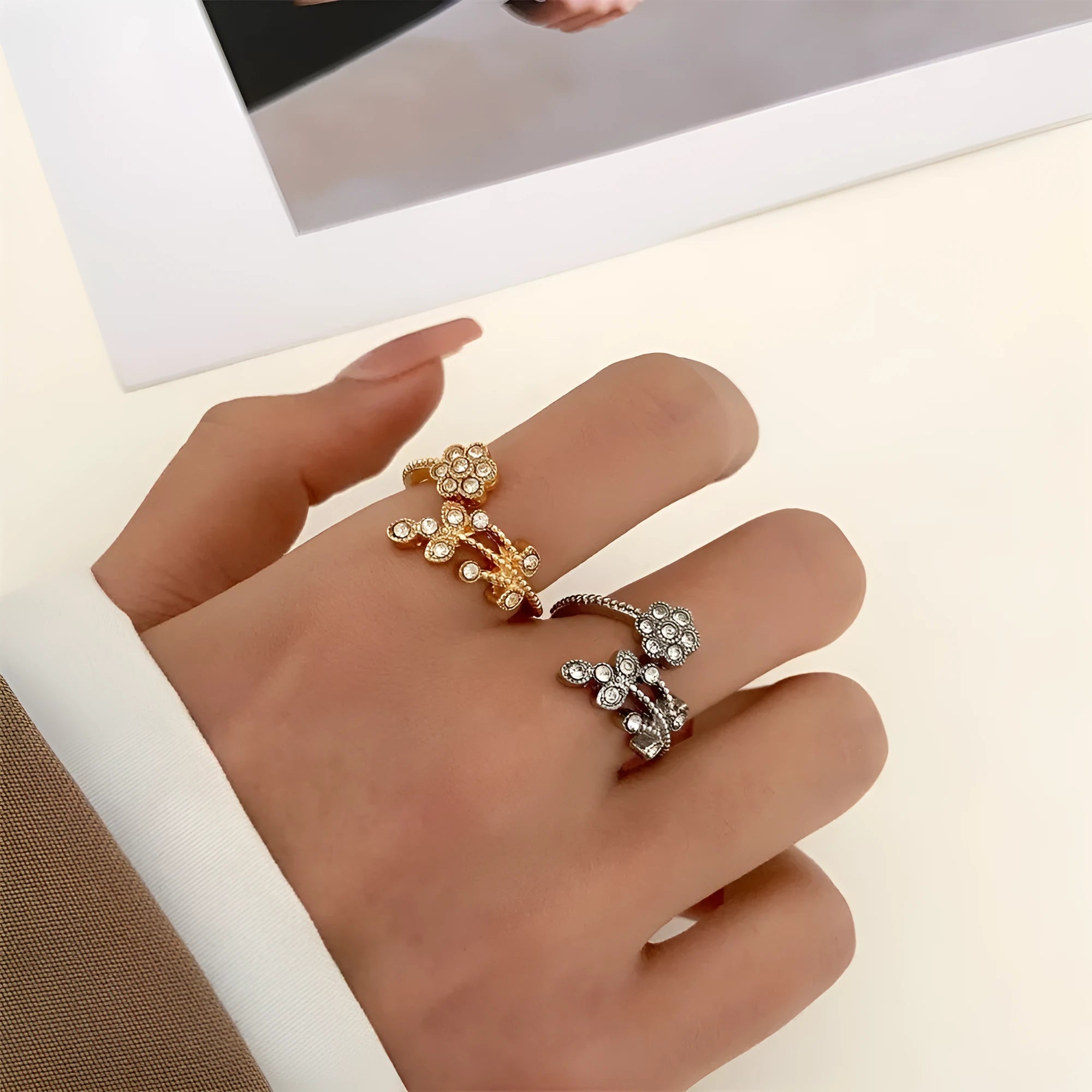 Women's diamond flower leaves open ring in gold and white colour options showing floral design