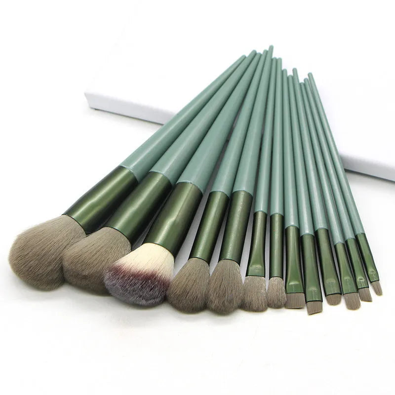 13 piece green makeup brush set with man-made fibre bristles and plastic handles