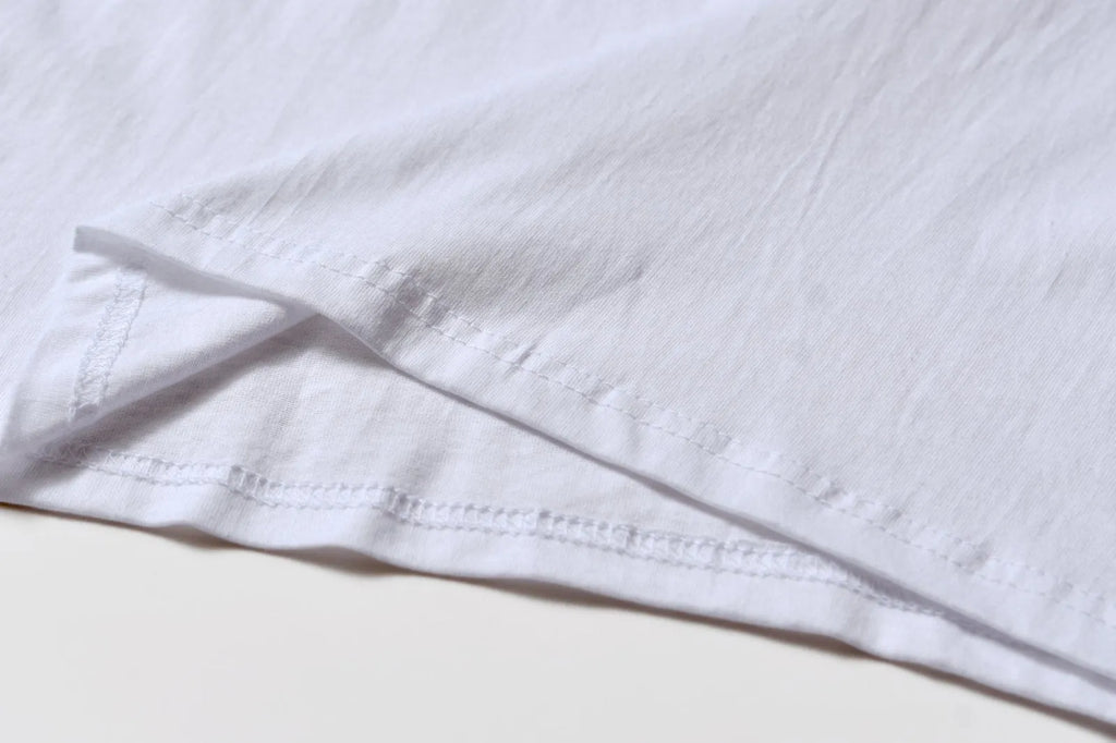 White cotton overalls with round neck and short sleeves in loose pullover style