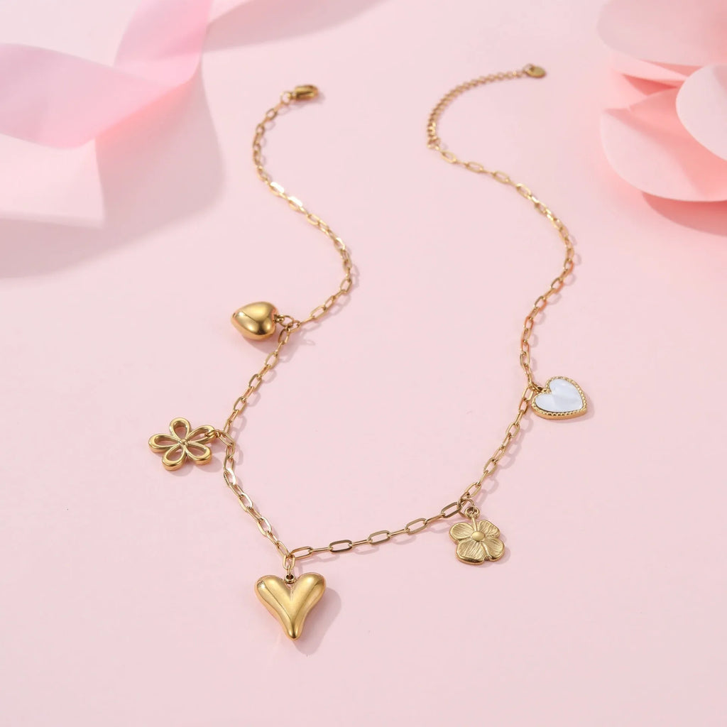 Stainless steel necklace with an 18K gold electroplated geometric pendant on an adjustable chain.