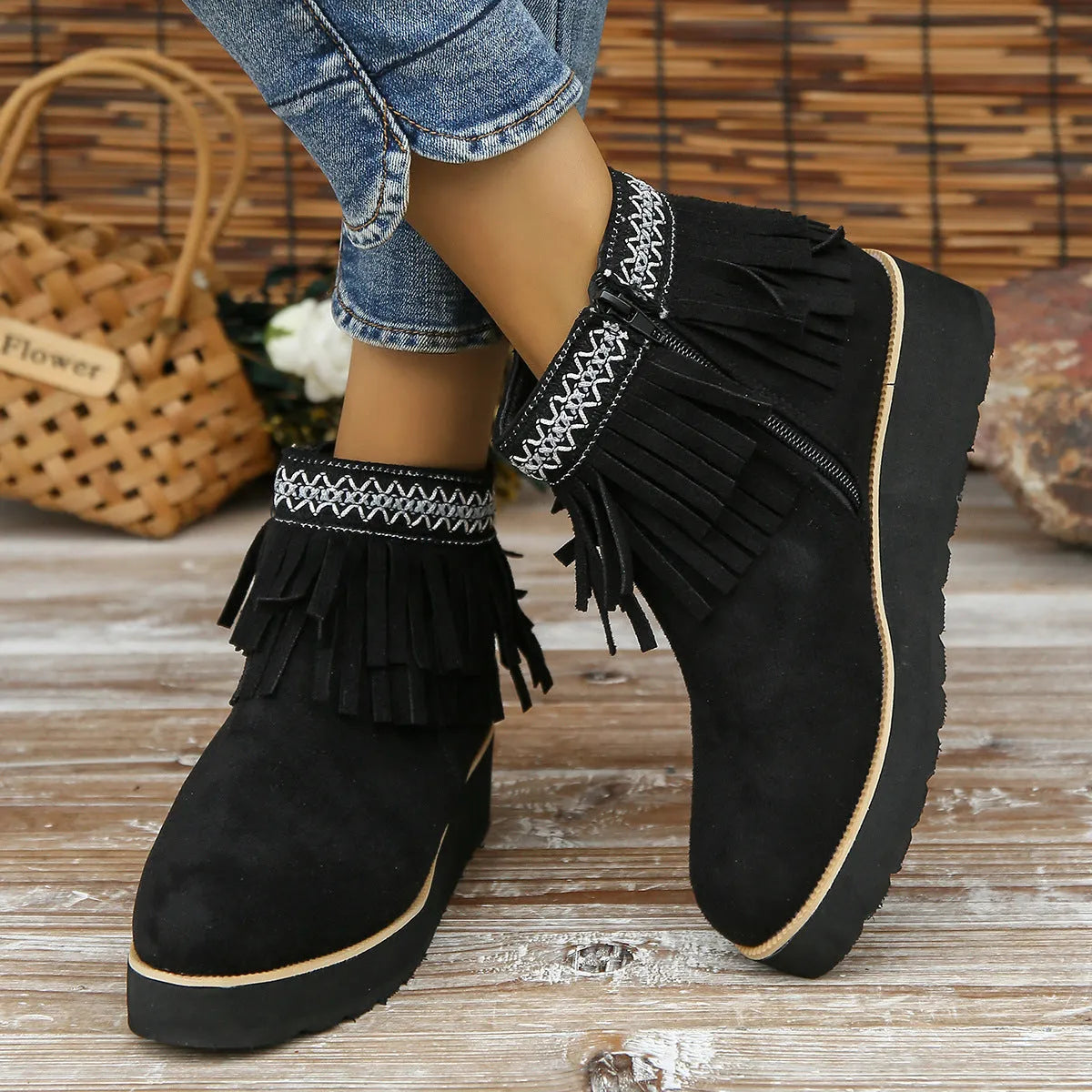 Women's suede wedge ankle boot with side zipper and tassel detail in black