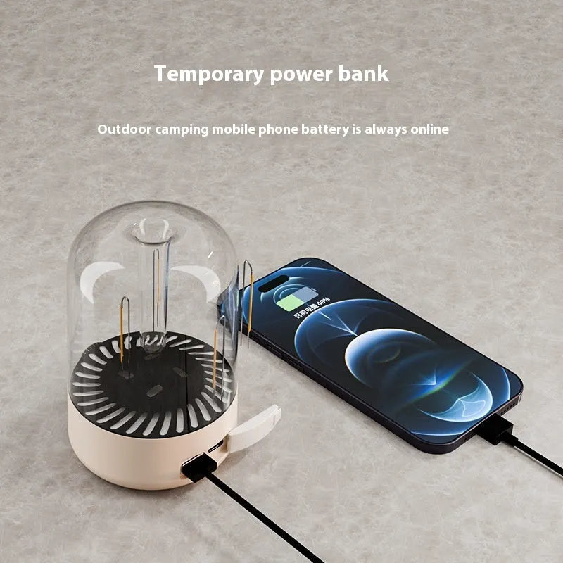 Beige camping ambience light with dual lamp beads, USB output, and analogue knob on a wooden table