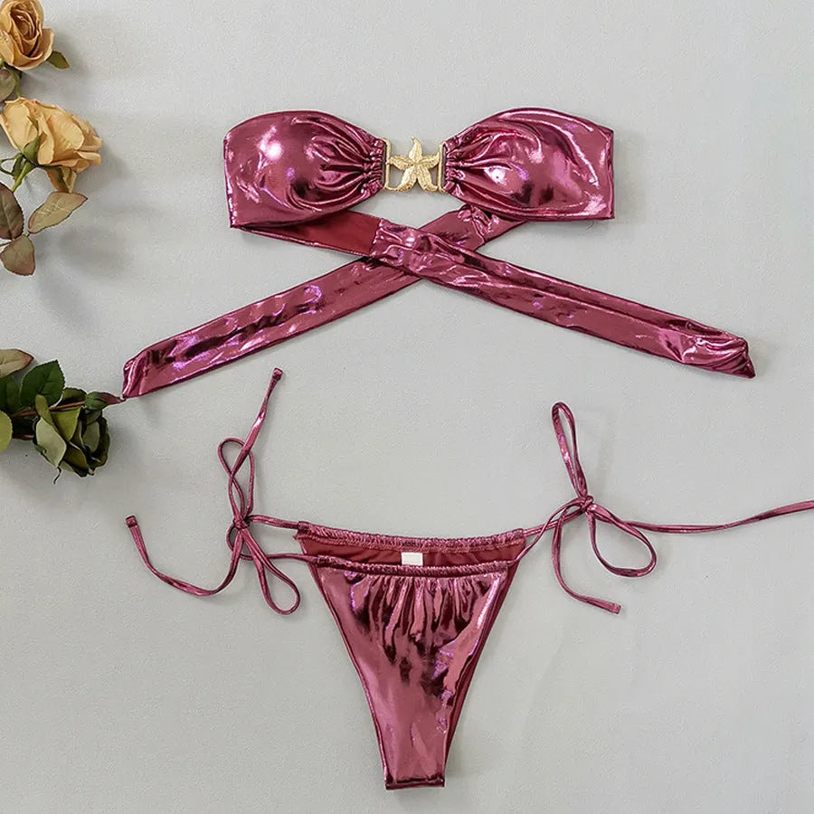 Women's glossy sapphire blue tube top bikini with starfish detail and long sleeves.