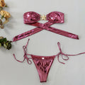 Women's glossy sapphire blue tube top bikini with starfish detail and long sleeves.