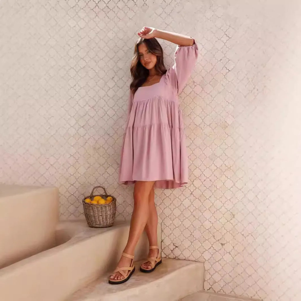 Orange backless children's dress with a square collar and puff sleeves in an A-line silhouette.