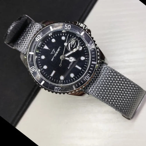 Nylon textile watch strap in army green colour with metal buckle, shown alongside black and blue options.