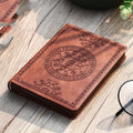 Portable mini A6 notebook with imitation leather cover and pen in black