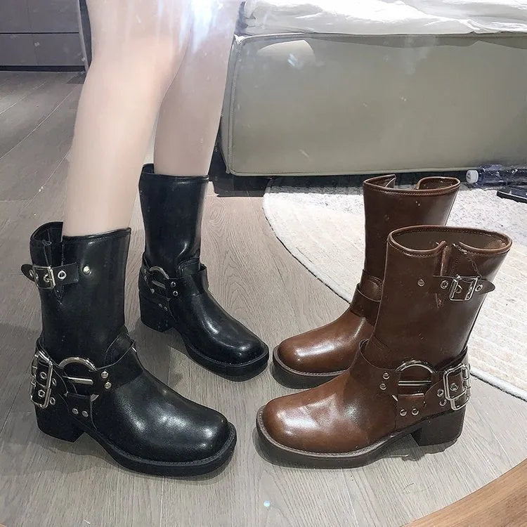 Women's black platform boots with buckle strap at middle calf length