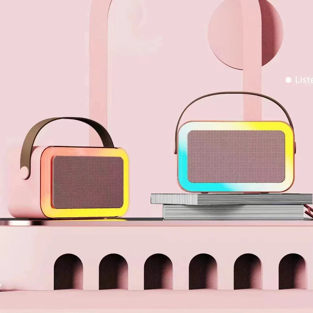 Portable karaoke microphone Bluetooth speaker with coloured lights in pink, sky blue, and white colour options