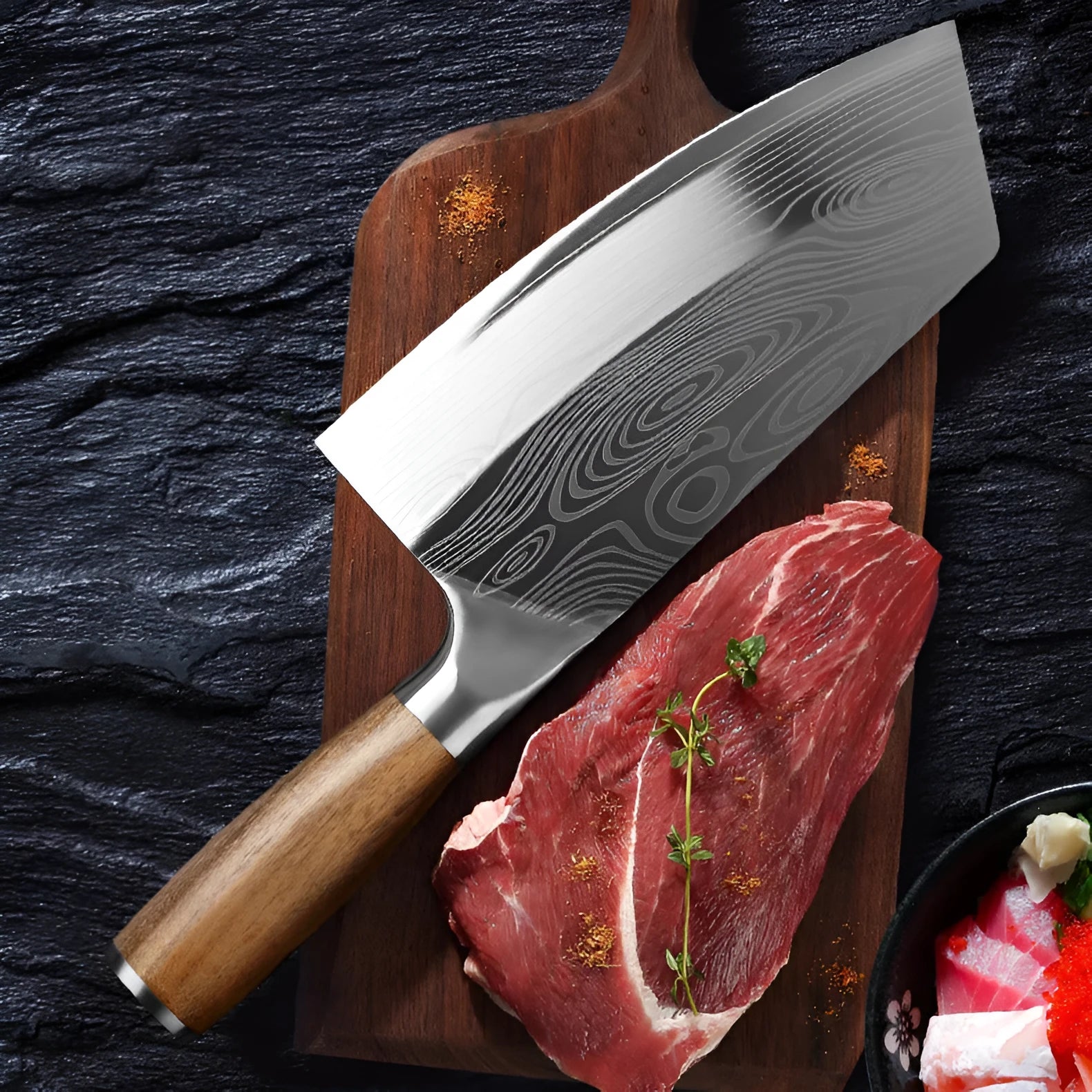 A stainless steel kitchen knife with a 320mm blade on a cutting board.