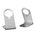Silver vertical adjustable magnetic phone bracket for iPhone 12 series on a flat surface.