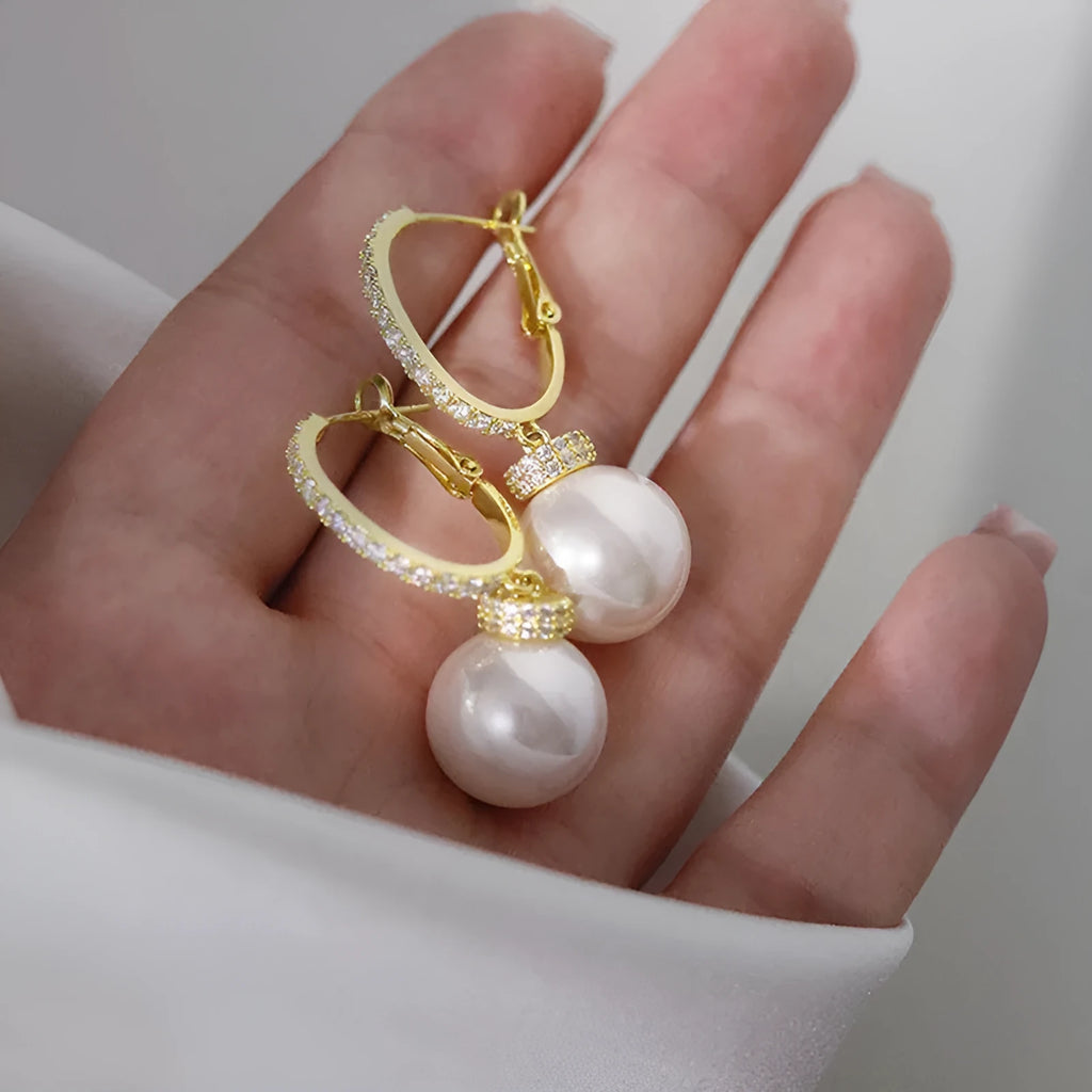 Yellow gold finish earrings with imitation pearls and inlaid zircon on copper base