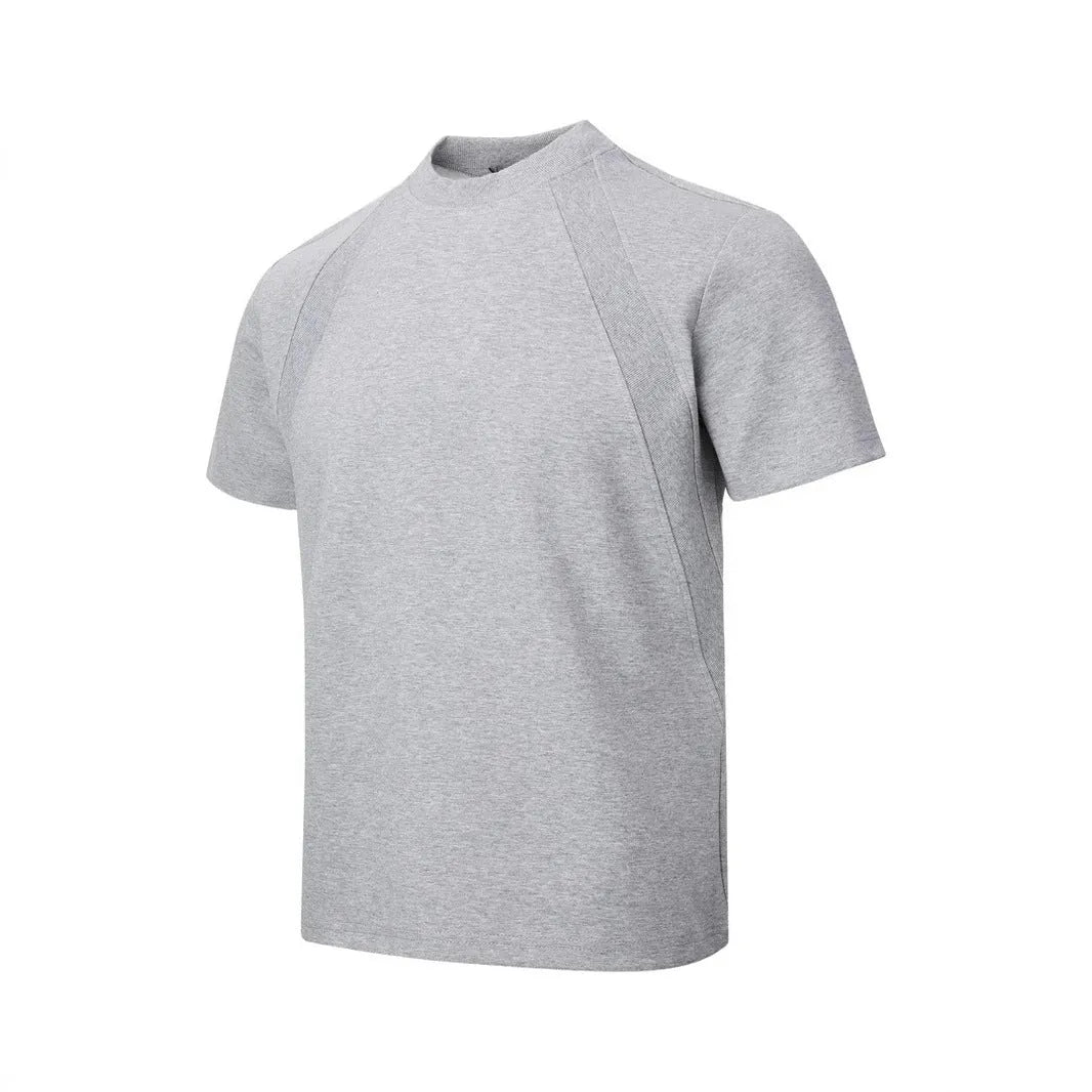 Men's loose black short sleeve top with textured air layer stitching on a grey background