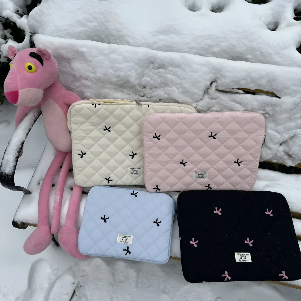 Embroidered rhombus bow detail on nylon laptop storage bag in light blue colour