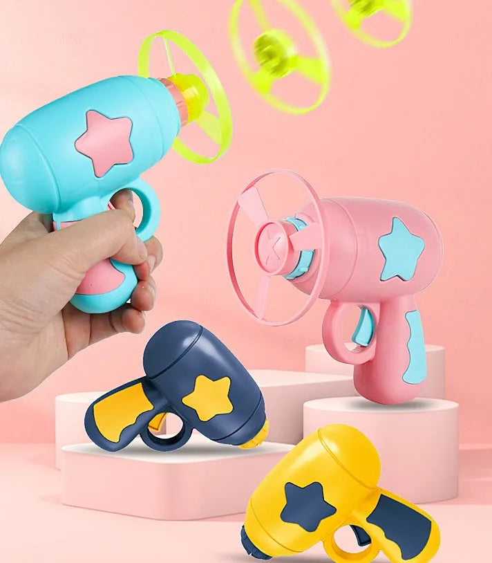 LED light-up flying saucer toy set with launcher gun, three glowing discs, and target board.