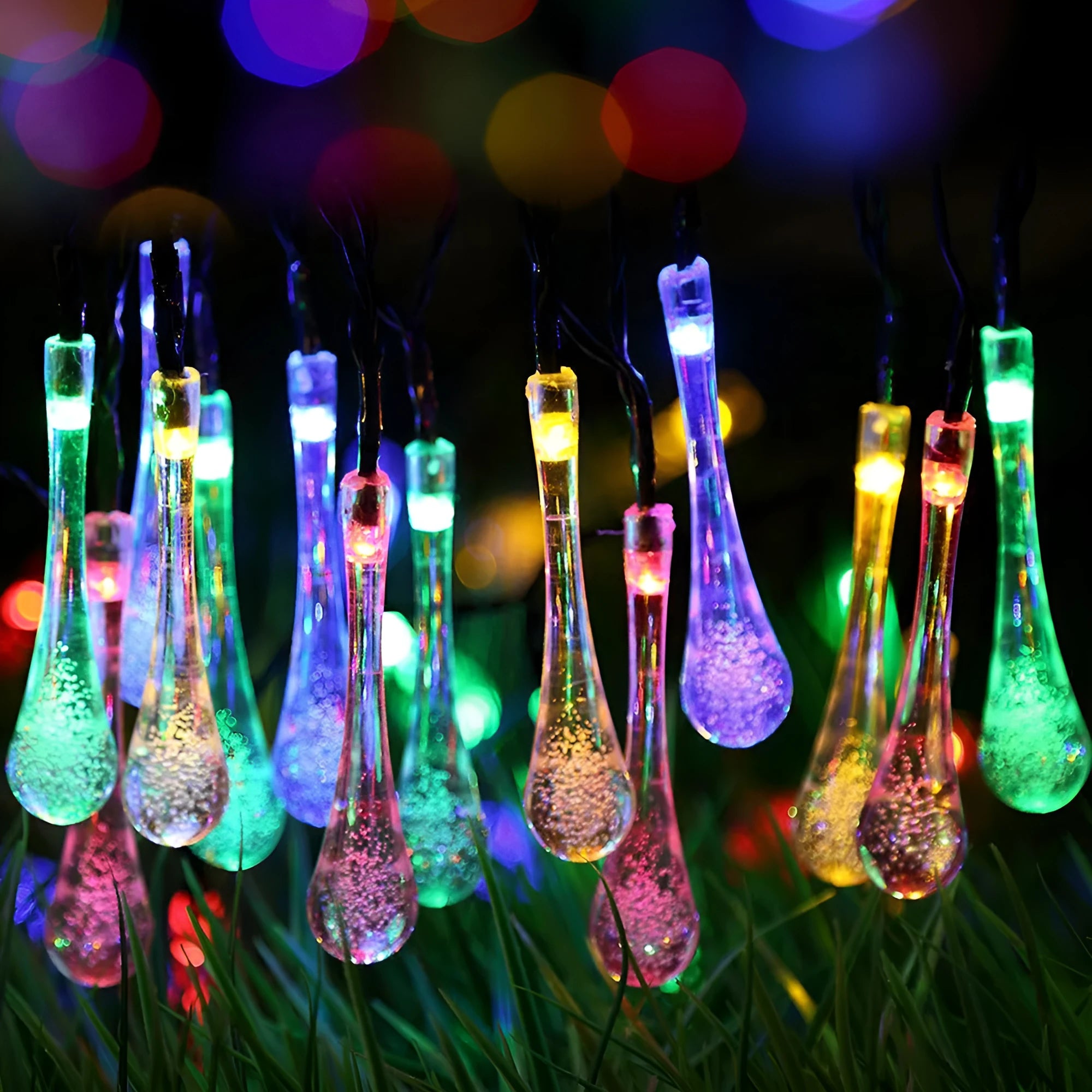 Solar-powered LED Water Drops string lights installed outdoors with 30 bulbs on a 6.5 metre waterproof cable