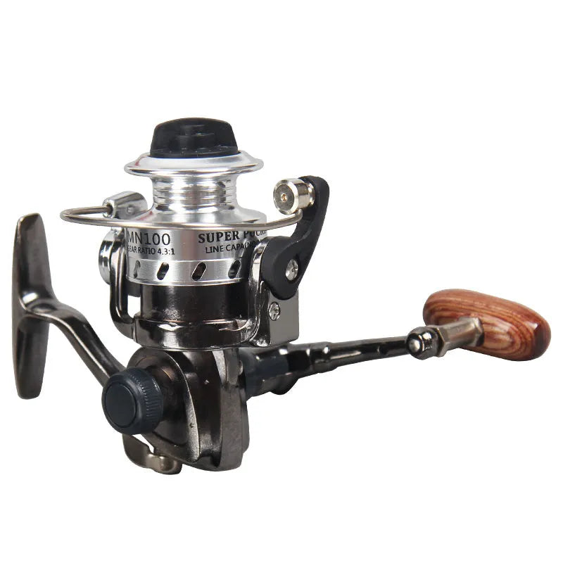Mini 100 all metal fishing reel in black, 8cm high, with wooden handle rocker arm folded