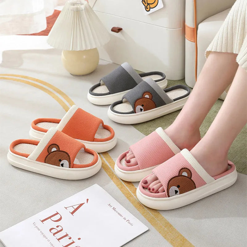 Cartoon bear cotton linen indoor slippers with PVC non-slip sole, shown in orange, pink, silver grey, and light brown