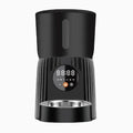 Black and white automatic pet feeder with USB power connection for timed remote feeding