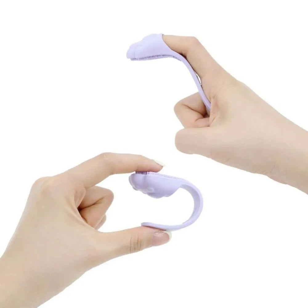 Silicone finger cover toothbrush for pet dental cleaning in pink, purple, and yellow colours.