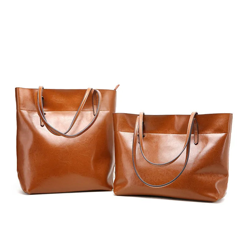 Horizontal wax cowhide leather handbag showing cross-body strap and internal organisation with phone pocket