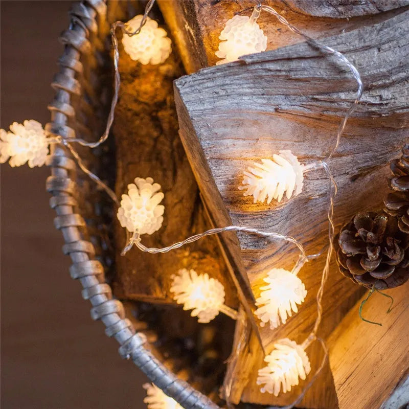 LED pine cone decorative light string with warm white bulbs and plastic shells, battery powered for flexible placement