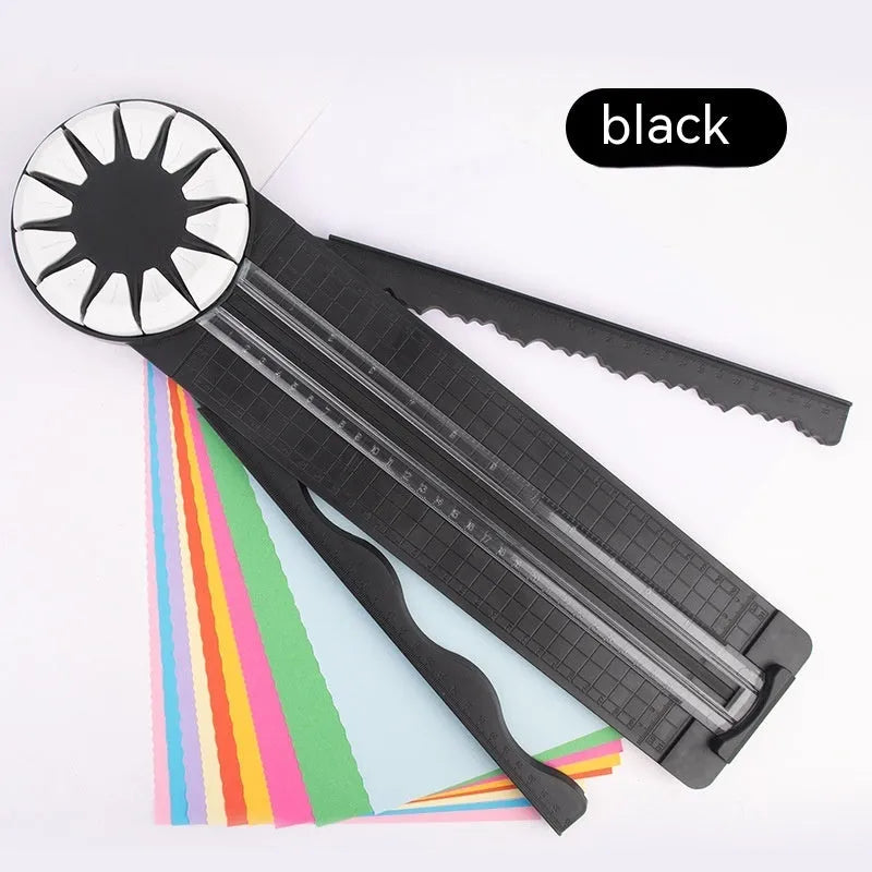 Pink and black 12-in-1 manual plastic paper cutting machine on a white background.
