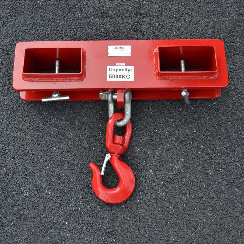 Iron forklift crane hook with rotatable drum and safety locking mechanism mounted on forklift forks.
