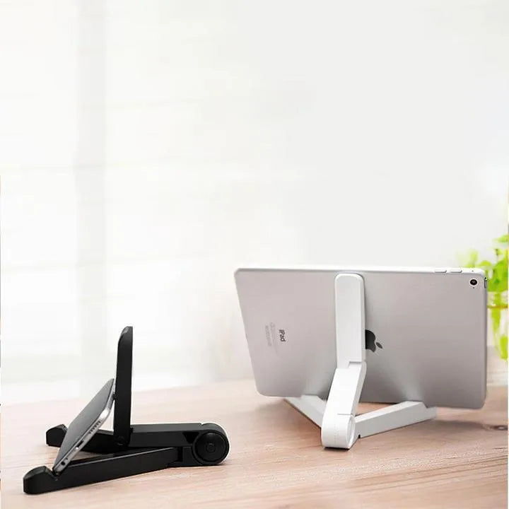 Black foldable tablet holder supporting a smartphone in landscape viewing mode on a desk.