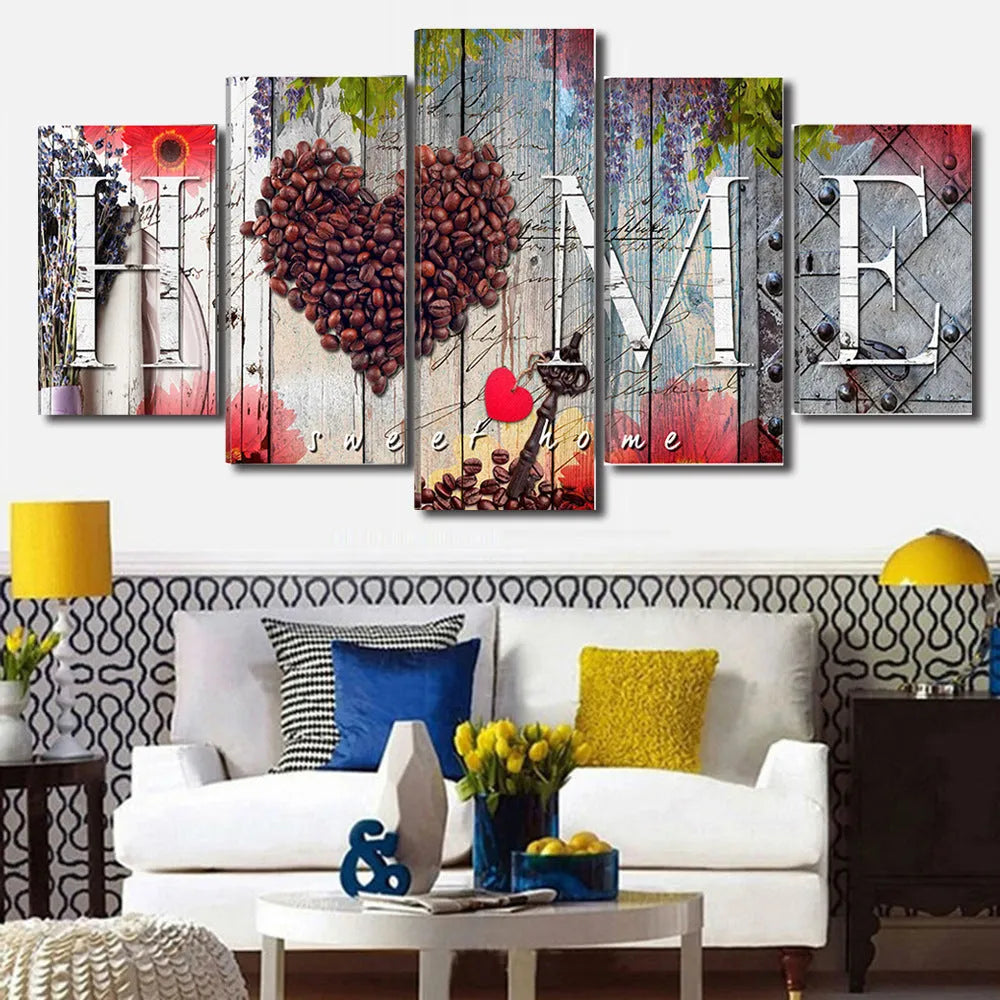 Set of five red unframed canvas wall art prints in graduated sizes arranged on a wall.