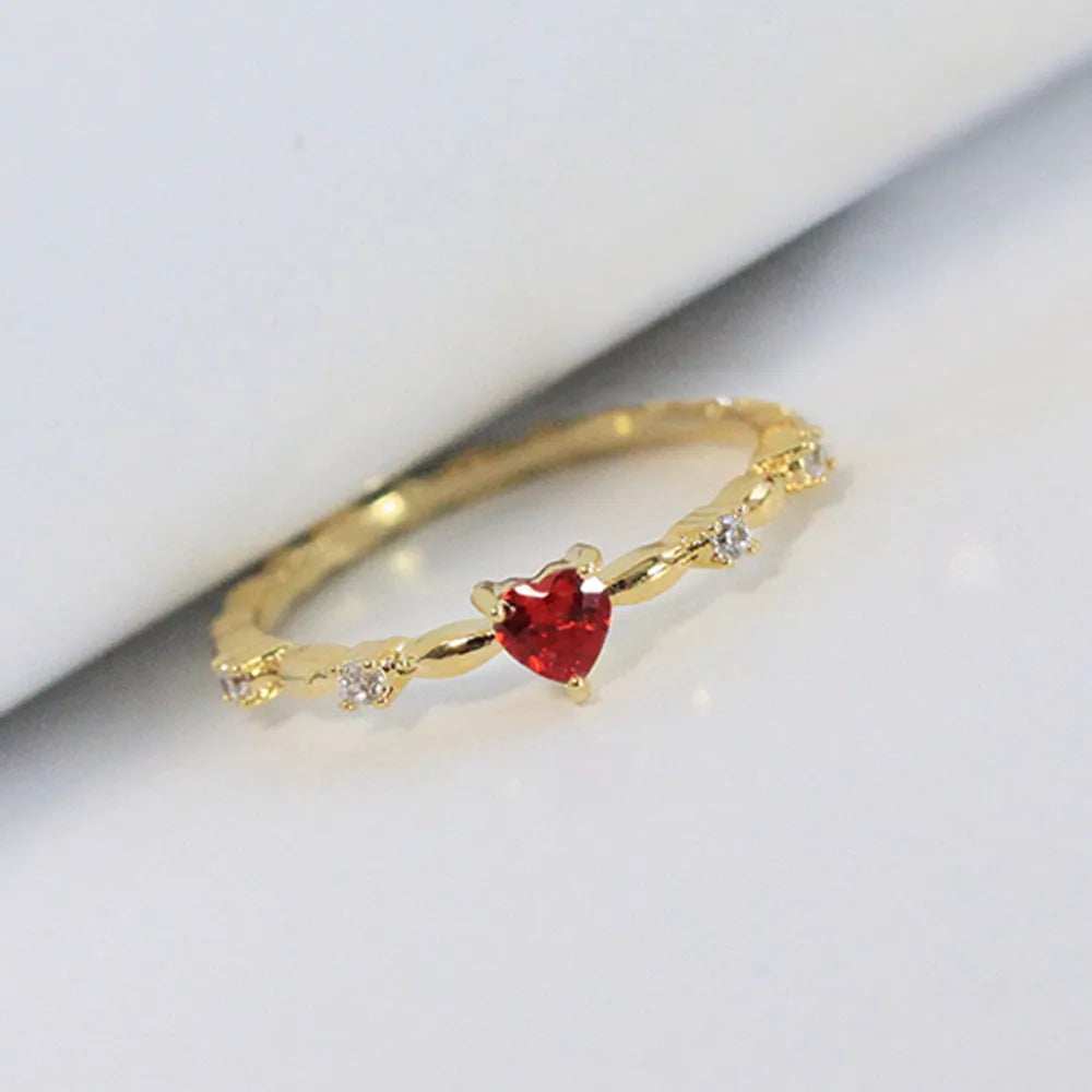 Gold or silver electroplated peach heart ring with zircon detailing on copper base