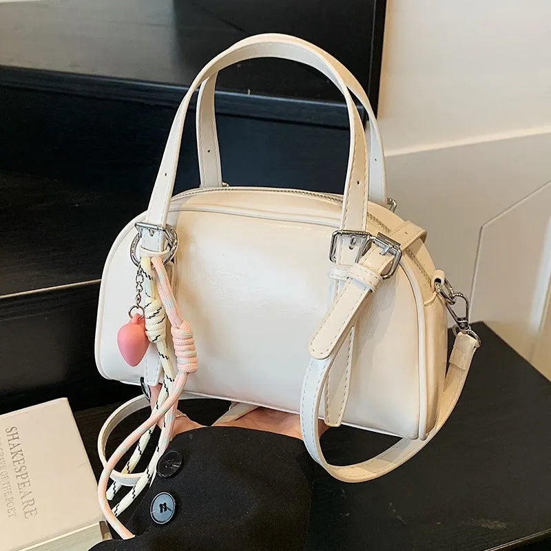 Korean style small square shoulder bag in soft PU leather with shell silhouette