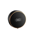 Black automatic foam soap dispenser mounted on wall with USB charging cable