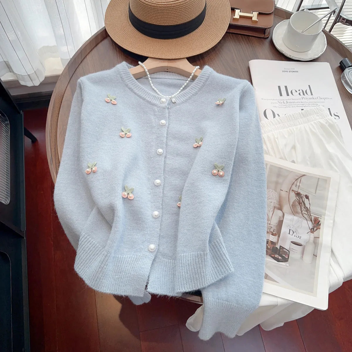 Women's slim fit beaded cardigan coat in cashmere blend, shown in blue, pink, red, and white colour options.