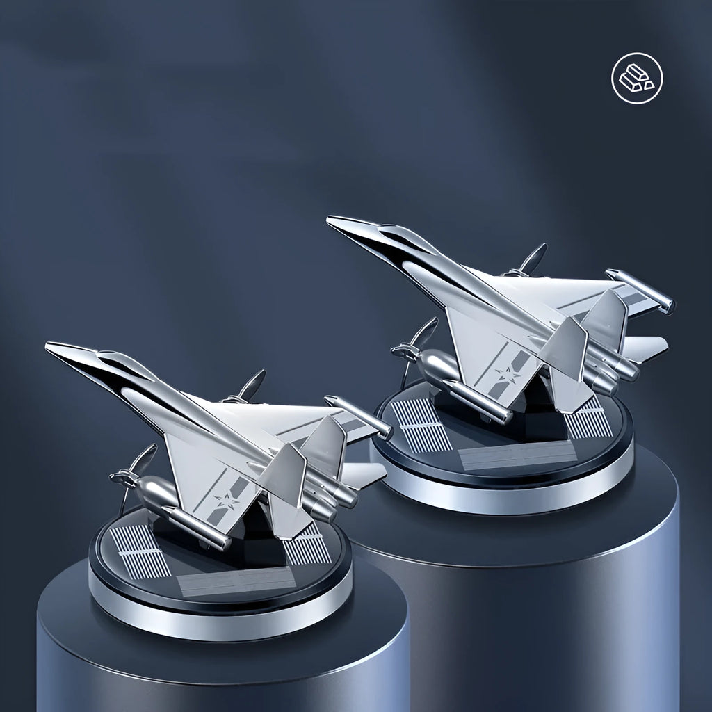 Silver solar-powered rotating fighter aircraft perfume ornament on a beech wood diffuser with essential oil bottle